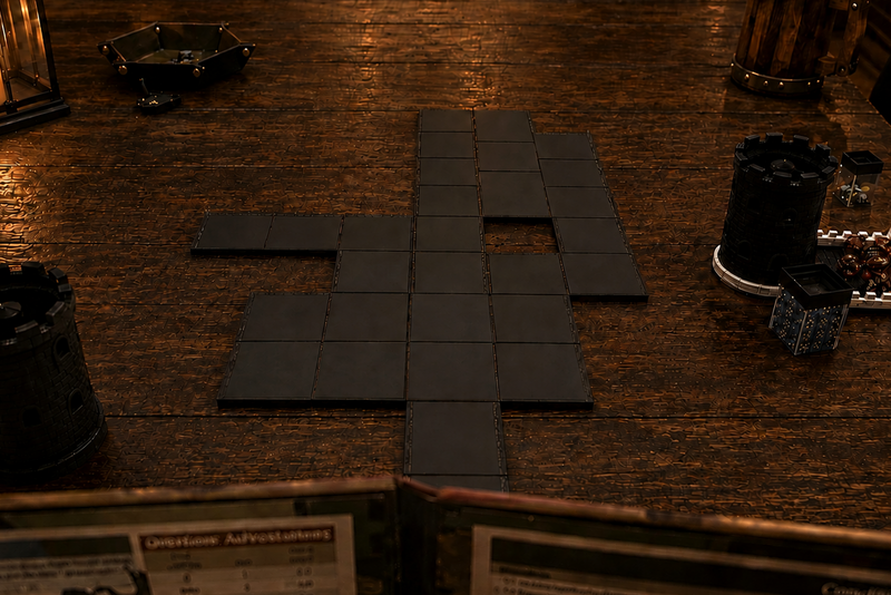 Dark tabletop scene with a set of black rectangular terrain tiles arranged in a cross shape on a wooden table, surrounded by candles, lanterns, and gaming accessories in a dimly lit environment.